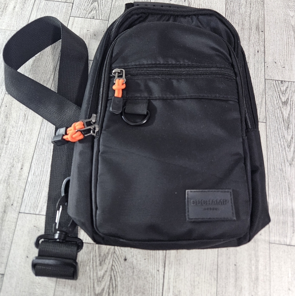 Duchamp London sling bag black crossbody bag with orange zipper pulls